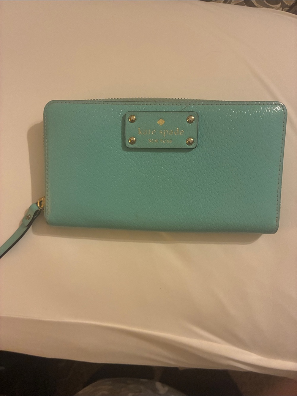 kate spade turquoise zip-around wristlet wallet